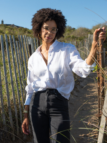 Ayana is wearing the Preston Top in White and Star Jean in Seine.