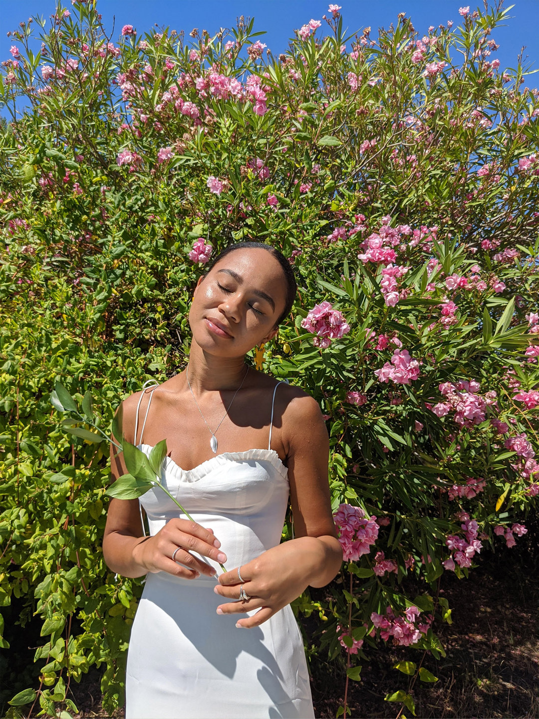 Mikaela is wearing the Ronan Dress in IVORY.